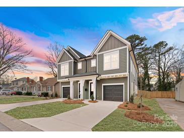 New construction duplex boasting neutral color palette, attached garages, and modern curb appeal at 2221 Edison St, Charlotte, NC 28206