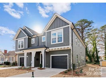 Modern two-story home with gray siding and a two-car garage at 2221 Edison St, Charlotte, NC 28206