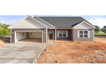 New construction exterior with a two-car garage and a covered front porch at 5177 Flay Rd, Lincolnton, NC 28021