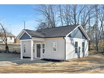 Newly constructed craftsman style home with gray accents and a welcoming front porch at 606 York Ave, Statesville, NC 28677