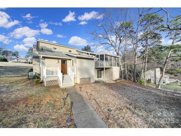 Charming home featuring a two-story screened porch and inviting front entrance at 1019 Palmyra Dr, Fort Mill, SC 29708