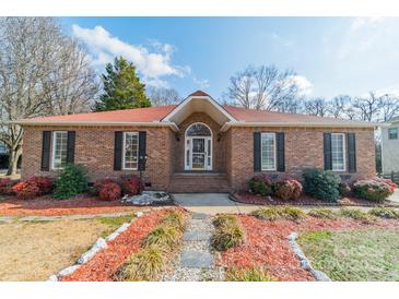 Charming brick home with a well-manicured front yard and walkway leading to the front door at 3447 Nesting Ln, Fort Mill, SC 29708