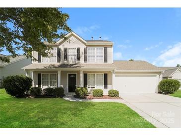 Two-story house with beige siding, a dark-colored front door, and a two-car garage at 1614 Hardy Dr, Rock Hill, SC 29732