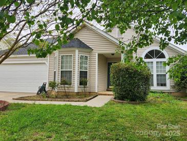 Charming one-story home featuring a bay window, well-maintained lawn, and a two-car garage at 3507 Southern Ginger Dr, Indian Trail, NC 28079