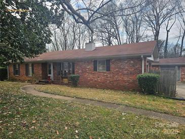 Brick ranch house with a large yard at 6209 Channing Ct, Charlotte, NC 28215