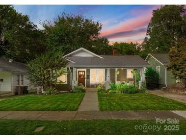 Charming single Gathering home with a landscaped front yard and inviting front porch at 1740 Wilmore Dr, Charlotte, NC 28203