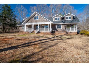 Charming home featuring a welcoming front porch and beautiful architectural details at 3044 Old Church Rd, Gastonia, NC 28052