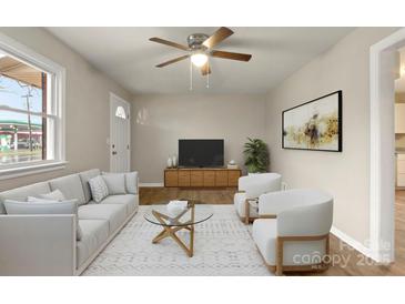 Inviting living room with a large window, ceiling fan, and comfortable seating area at 901 Wyke Rd, Shelby, NC 28150