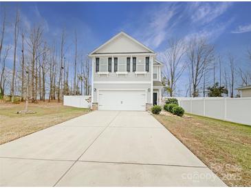 Two-story house with gray siding, a two-car garage, and a landscaped front yard at 1721 Ameria Rd, Charlotte, NC 28215