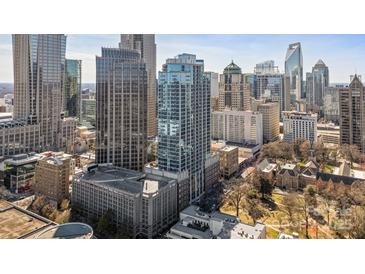 Stunning aerial view of a high-rise building with modern architecture in a thriving downtown cityscape at 210 N Church St # 2411, Charlotte, NC 28202