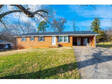 Charming brick ranch-style home with a covered carport and a well-maintained front yard at 2745 33Rd Ne Ave, Hickory, NC 28601