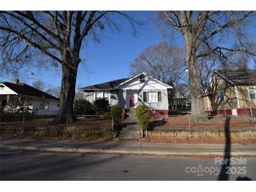 Gray house with red brick steps, situated on a tree-lined street at 315 S Hill St, Gastonia, NC 28052