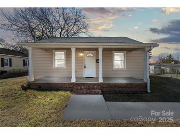 Charming home featuring a covered front porch with columns and brick accents at 505 Kings Mountain St, Clover, SC 29710