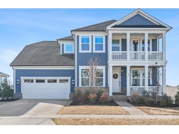 Two-story home with gray siding, white trim, and a two-car garage at 523 Rock Skip Way, Fort Mill, SC 29708