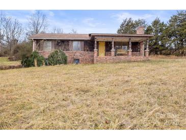 Brick ranch house with covered porch and large yard at 643 Alf Hoover Rd, Lincolnton, NC 28092