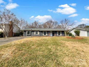 Charming ranch home with newly painted exterior and landscaping at 7015 Cardigan Ave, Charlotte, NC 28215