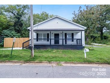 Charming white house with a front porch and well-maintained lawn at 815 3Rd St, Kings Mountain, NC 28086