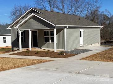 Gray house with a front porch and small yard at 1027 Adams St, Statesville, NC 28677