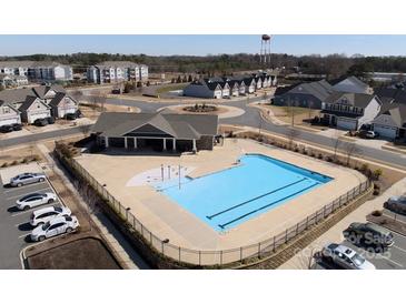 Community pool area featuring a large pool, a splash pad, and a covered pavilion at 1036 Barnette Farm Ln, Monroe, NC 28110