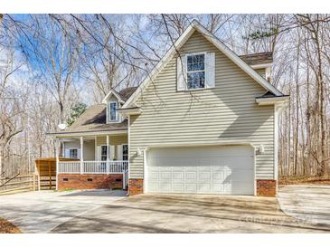 Charming home featuring a two-car garage, vinyl siding, and a cozy front porch at 2288 S Paraham Rd, York, SC 29745