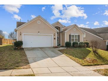 Charming single Gathering home with a two car garage and manicured lawn at 2943 Village Center Dr, Dallas, NC 28034