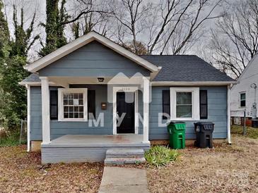 Gray house with a porch, steps, and a small yard at 3138 Morson St, Charlotte, NC 28208