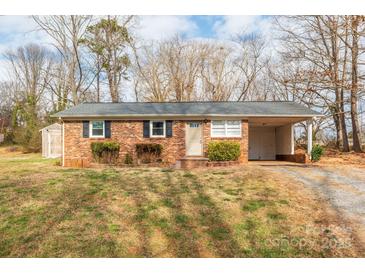 Brick ranch house with carport and storage shed at 3301 10Th Ne Ave, Conover, NC 28613