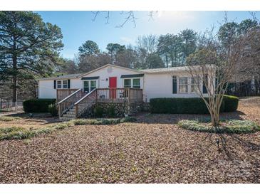 Charming single-story home with a welcoming front porch and well-maintained landscaping at 1762 Tomes Rd, Lincolnton, NC 28092