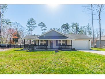 Charming single-story home featuring a front porch, well-manicured lawn, and attached one-car garage at 6835 Ingleside Dr, Sherrills Ford, NC 28673