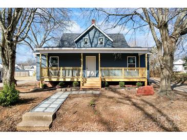 Charming renovated home with a welcoming front porch and landscaped yard at 806 S Martin Luther King Ave, Salisbury, NC 28144