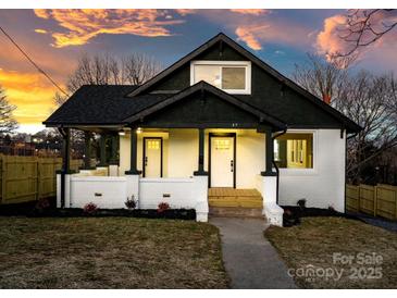 Renovated bungalow, featuring a dark green exterior and white trim at 49 8Th Se St, Hickory, NC 28602