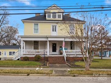 Charming two-story home boasts a welcoming front porch and classic architectural details at 331 E White St, Rock Hill, SC 29730