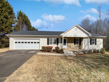 Ranch style home with attached garage and stone accents at 153 Pattys Pl, Stony Point, NC 28678