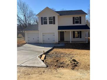 Two-story house with a two-car garage and a concrete driveway at 1606 Lincoln Dr, Shelby, NC 28152