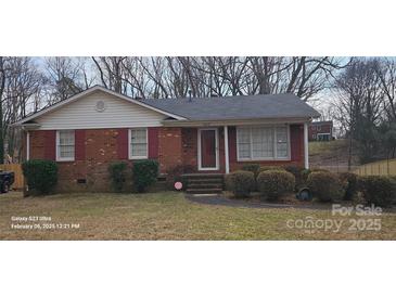 Charming brick home with manicured front yard and inviting entrance at 7219 Brynhurst Dr, Charlotte, NC 28210