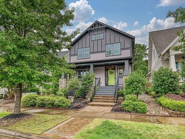 Charming two-story home with landscaped yard, brick walkway, and a vibrant green front door at 817 Digby Rd, Rock Hill, SC 29730