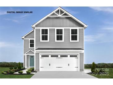 Charming two-story home with a gray exterior and white garage door at 320 Basildon St # 1076, Lancaster, SC 29720