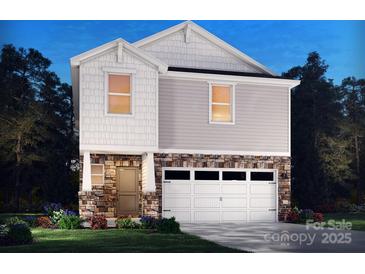 Charming two-story home featuring stone accents, white trim, and an attached two-car garage at 837 Blue Canyon Dr, York, SC 29745