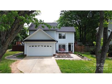 Charming two-story home features a well-maintained front yard and attached two-car garage at 3516 Mill Stream Ct, Charlotte, NC 28209