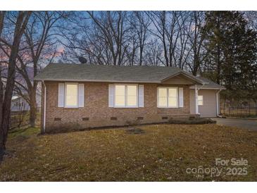 Cozy brick home with white shutters and a well-maintained lawn offers classic curb appeal at 515 Richards Rd, Chester, SC 29706