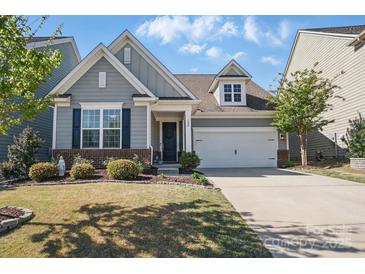 Charming home with grey siding, manicured lawn, and inviting entrance, offers curb appeal at 108 Hillston Ln, Mooresville, NC 28115