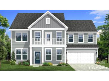 Charming two-story home featuring a covered porch and a two-car garage at 281 Supernova Dr, York, SC 29745