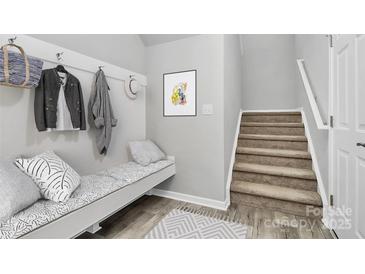 Inviting mudroom with coat hooks, bench seating, and stylish decor welcomes you home at 404 Brannon Meadows Dr # 270, York, SC 29745