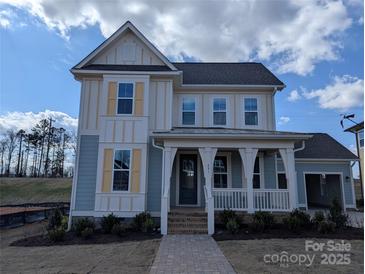 Inviting two-story home with a charming front porch and manicured lawn at 251 Luray Way # 441, Rock Hill, SC 29730