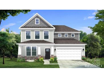 New construction two-story home showcasing gray siding, stone accents, covered porch, and an attached two-car garage at 889 Regulus Ct, York, SC 29745
