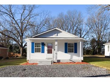 Charming home featuring blue shutters and a well-maintained front yard at 417 Baker Street Ext, Rock Hill, SC 29730