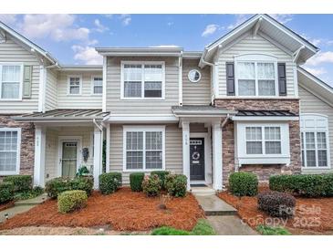 Charming townhome with stone accents, manicured landscaping, and a welcoming front entrance at 706 Cherryfield Pl, Rock Hill, SC 29732
