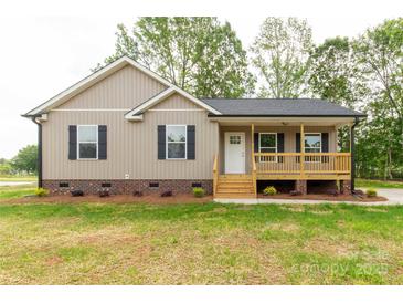Charming single-story home with a welcoming front porch and manicured lawn at 1323 Mack Dr, McConnells, SC 29726