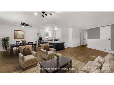 Bright living room boasts wood floors, neutral decor, and an open layout perfect for modern living at 1888 Usher Rd, Lancaster, SC 29720
