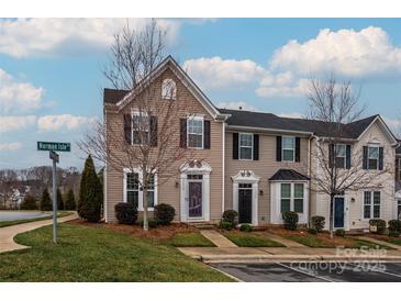 Charming townhome featuring a well-maintained lawn and a classic architectural design at 2692 Norman Isle Dr, Denver, NC 28037